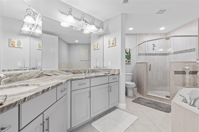 full bathroom with shower with separate bathtub, vanity, toilet, and tile patterned floors