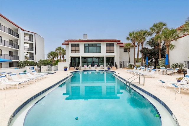 view of swimming pool featuring a patio