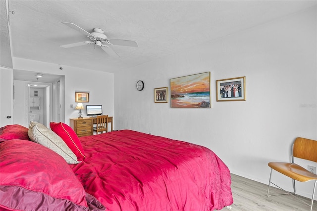 bedroom featuring a textured ceiling, light hardwood / wood-style flooring, and ceiling fan