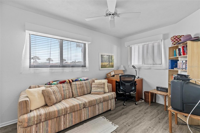 office area featuring ceiling fan, a wealth of natural light, and hardwood / wood-style floors