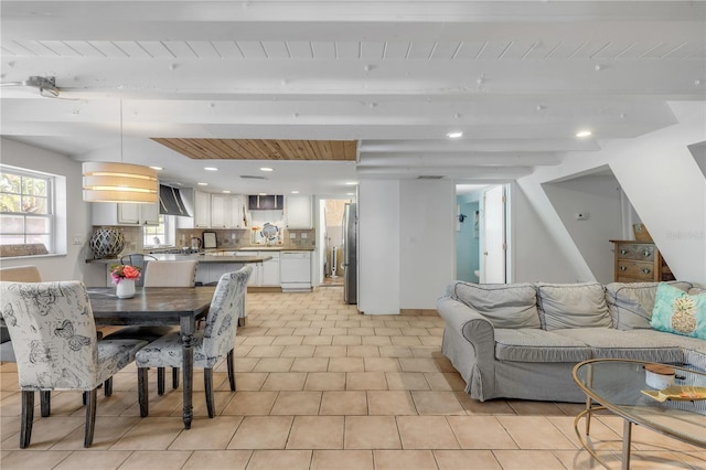 living room with beam ceiling