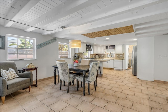 tiled dining area with beam ceiling and wooden ceiling