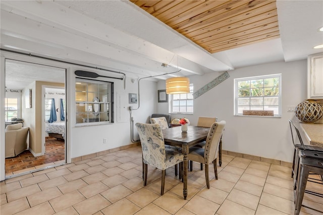 tiled dining space with wood ceiling