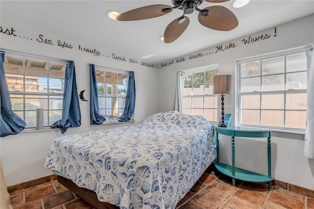 bedroom featuring ceiling fan