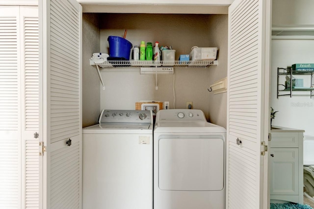 washroom with separate washer and dryer