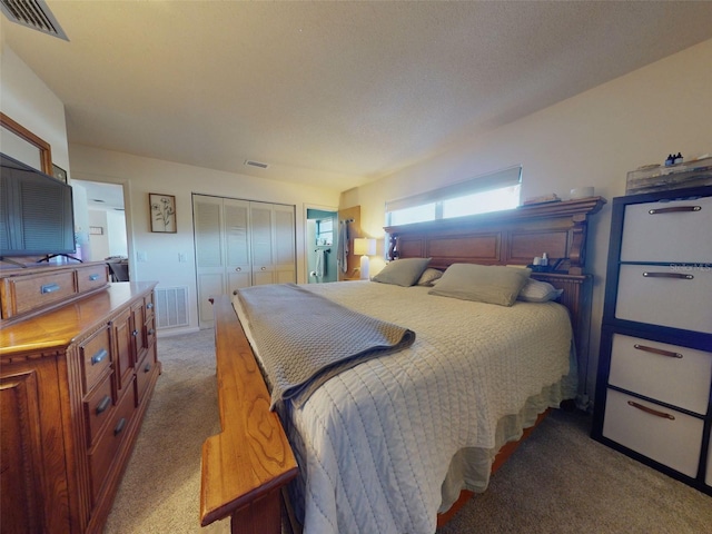 bedroom with carpet flooring and a closet