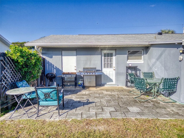 view of patio featuring a grill