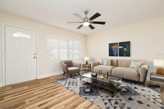 living room featuring hardwood / wood-style flooring and ceiling fan