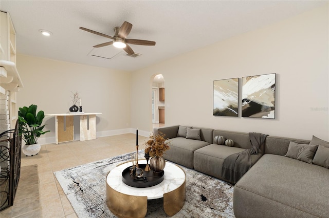 tiled living room featuring ceiling fan