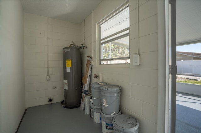 utility room featuring electric water heater