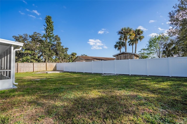 view of yard featuring a sunroom