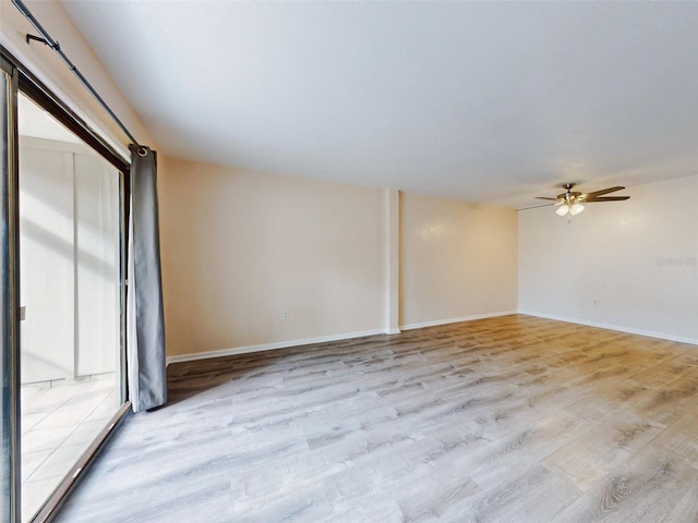 unfurnished room with ceiling fan, plenty of natural light, and light wood-type flooring