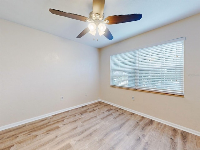 spare room featuring ceiling fan and light hardwood / wood-style flooring