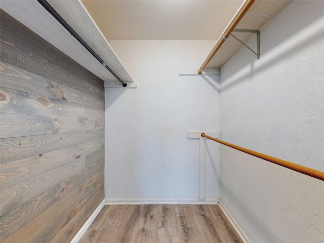 spacious closet featuring light wood-type flooring