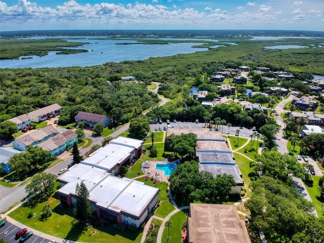 birds eye view of property with a water view