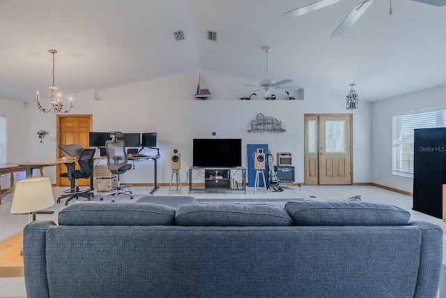 living room featuring ceiling fan with notable chandelier, lofted ceiling, and light tile patterned floors