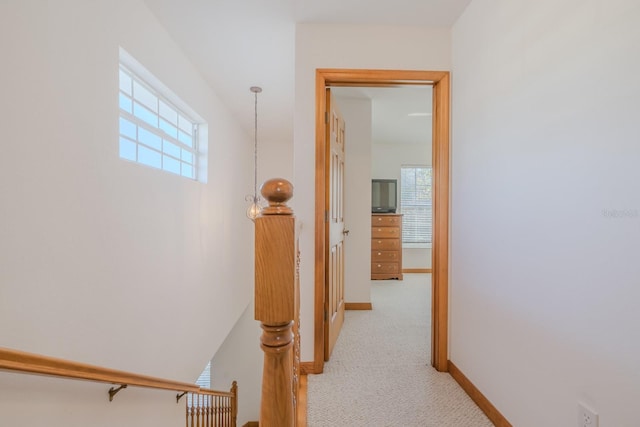 hallway with light carpet