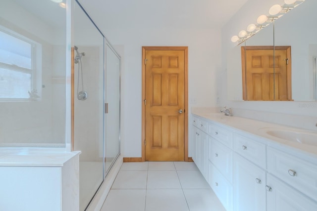 bathroom with vanity, tile patterned floors, and a shower with shower door