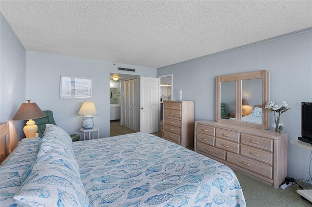 carpeted bedroom featuring a textured ceiling