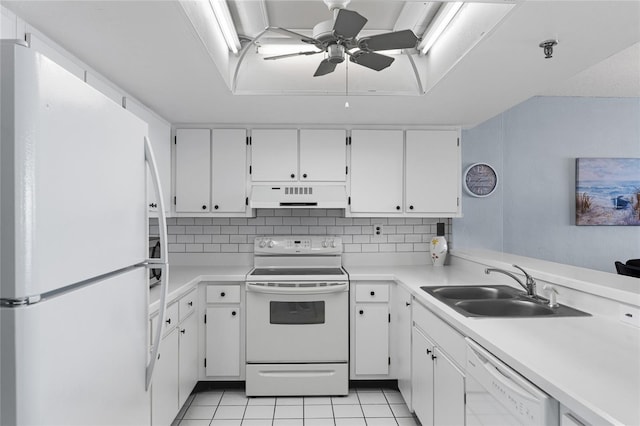 kitchen featuring light tile patterned flooring, white appliances, white cabinetry, and range hood