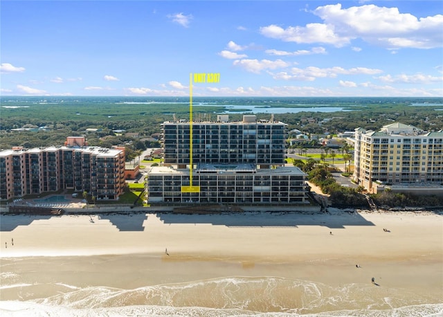 aerial view with a water view and a view of the beach