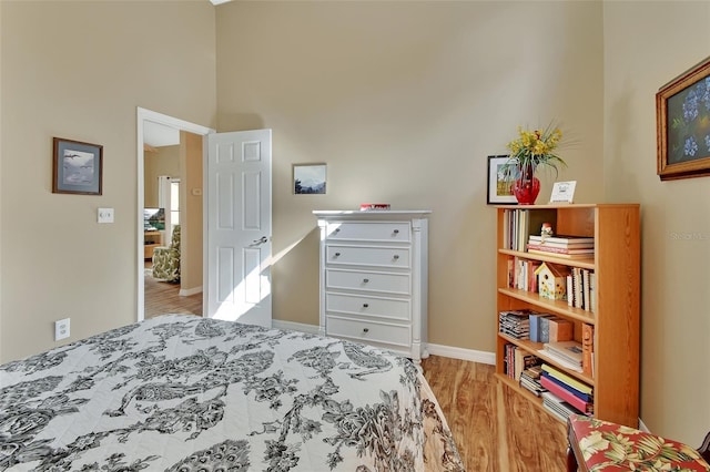 bedroom with light hardwood / wood-style flooring