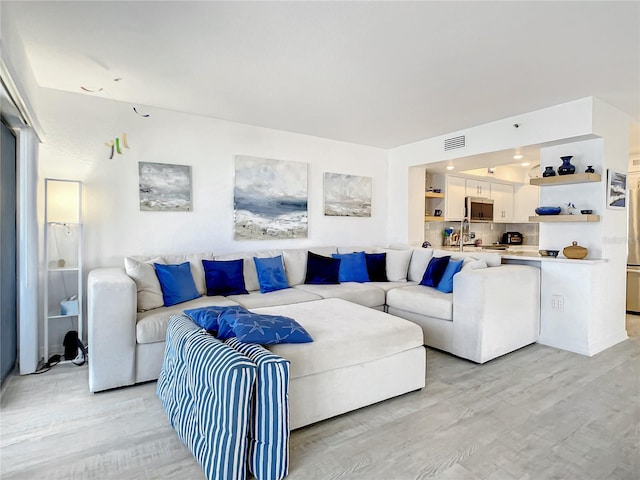 living room with light hardwood / wood-style floors