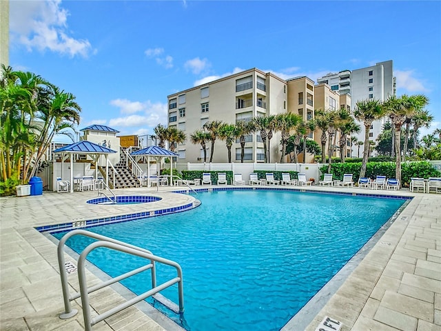 view of swimming pool with a gazebo and a patio