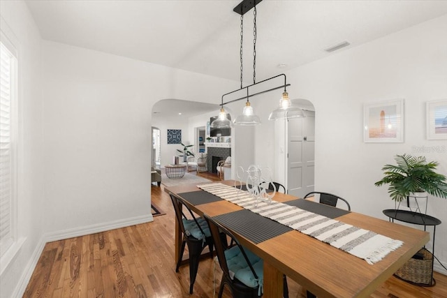 dining area with hardwood / wood-style floors