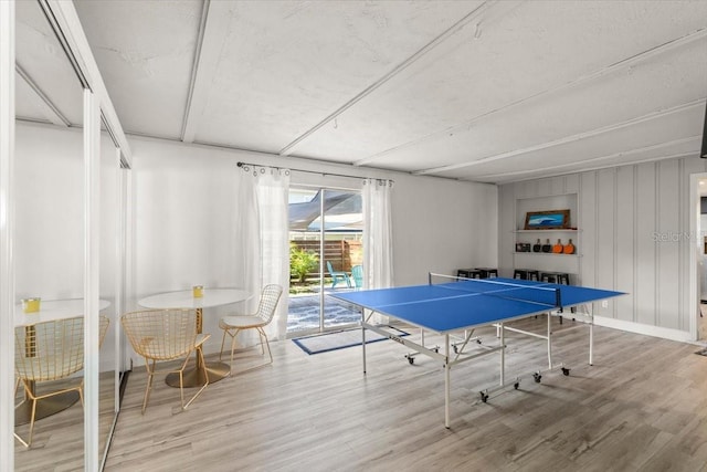 recreation room with hardwood / wood-style flooring