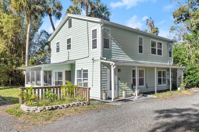 view of front facade featuring a sunroom