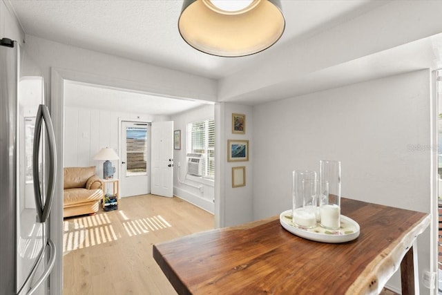 dining space featuring light wood-type flooring