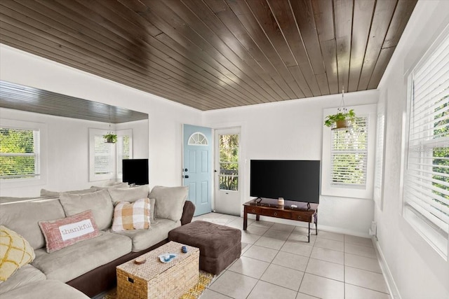 living room with wood ceiling, a wealth of natural light, and light tile patterned floors