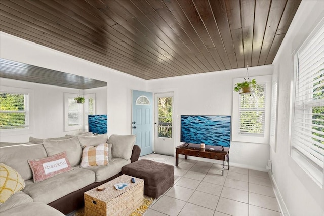 tiled living room featuring wooden ceiling and a healthy amount of sunlight