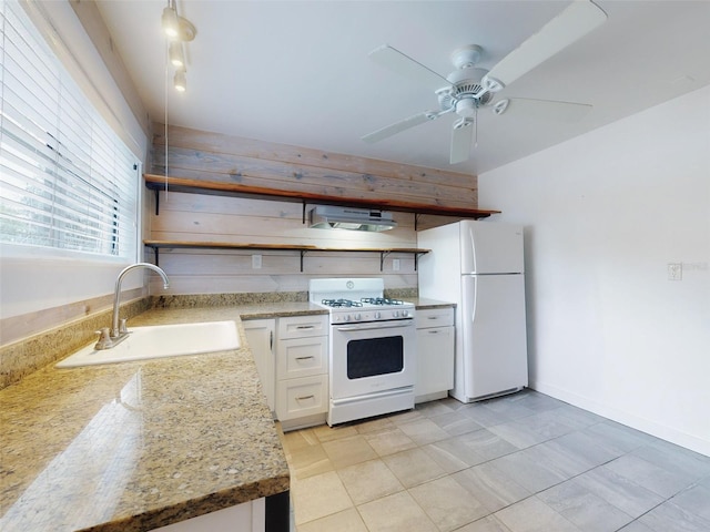 kitchen featuring white appliances, extractor fan, white cabinetry, ceiling fan, and sink