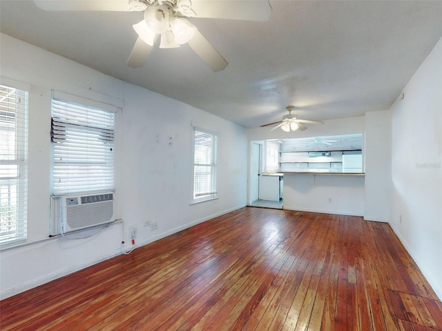 unfurnished living room with hardwood / wood-style flooring, ceiling fan, and cooling unit