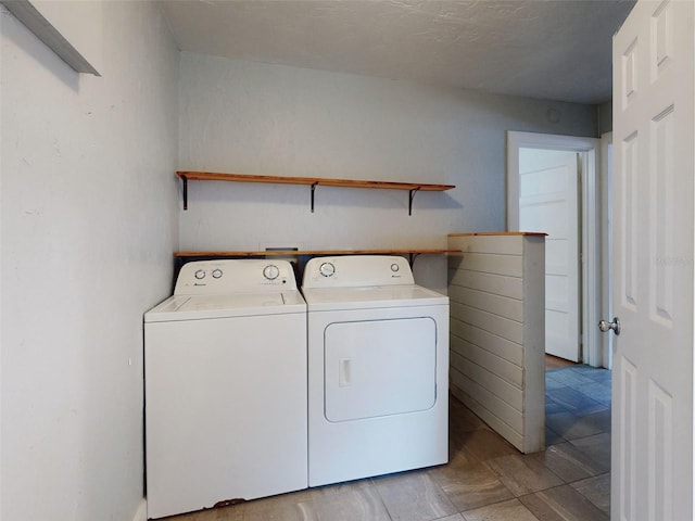 laundry room with washing machine and clothes dryer