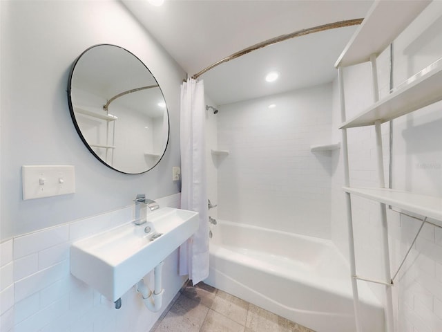 bathroom featuring shower / bath combo and sink