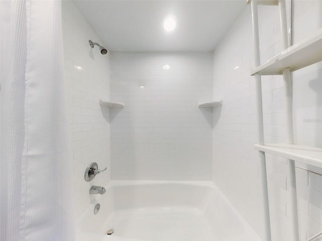 bathroom featuring shower / tub combo with curtain