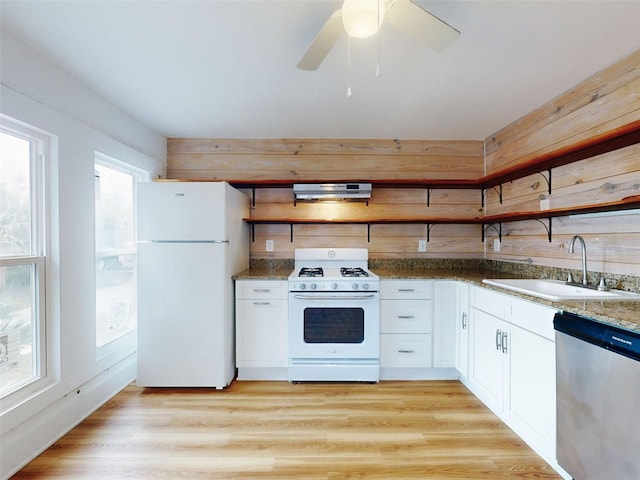 kitchen featuring white appliances, light hardwood / wood-style floors, sink, white cabinetry, and extractor fan