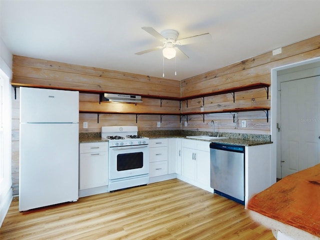 kitchen with white appliances, light hardwood / wood-style floors, white cabinetry, ceiling fan, and sink