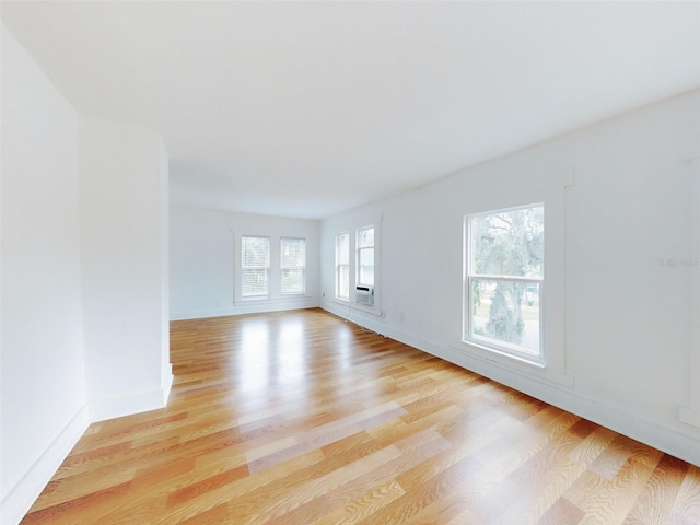 spare room featuring light hardwood / wood-style flooring