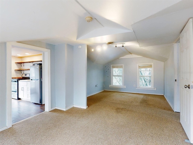 bonus room featuring carpet and lofted ceiling