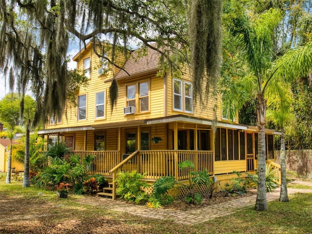 view of front of house with cooling unit and covered porch