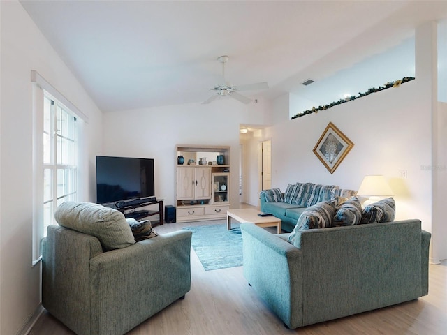 living room featuring ceiling fan and light hardwood / wood-style flooring