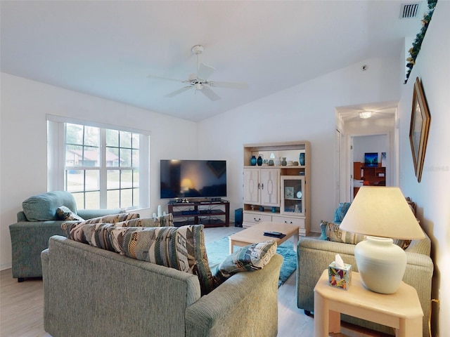 living room featuring light wood-type flooring, ceiling fan, and lofted ceiling