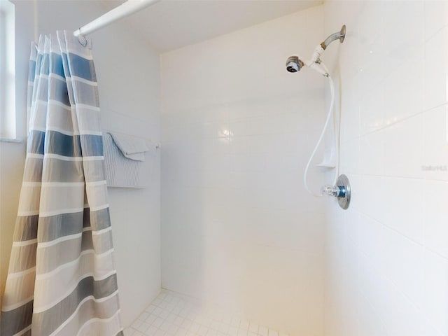 bathroom with a shower with shower curtain