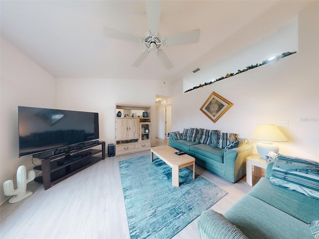 living room featuring ceiling fan and light wood-type flooring