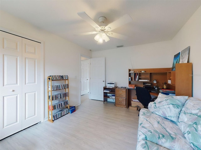 office area with light hardwood / wood-style floors and ceiling fan