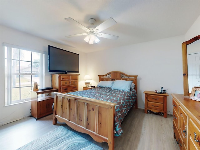 bedroom featuring ceiling fan and light wood-type flooring